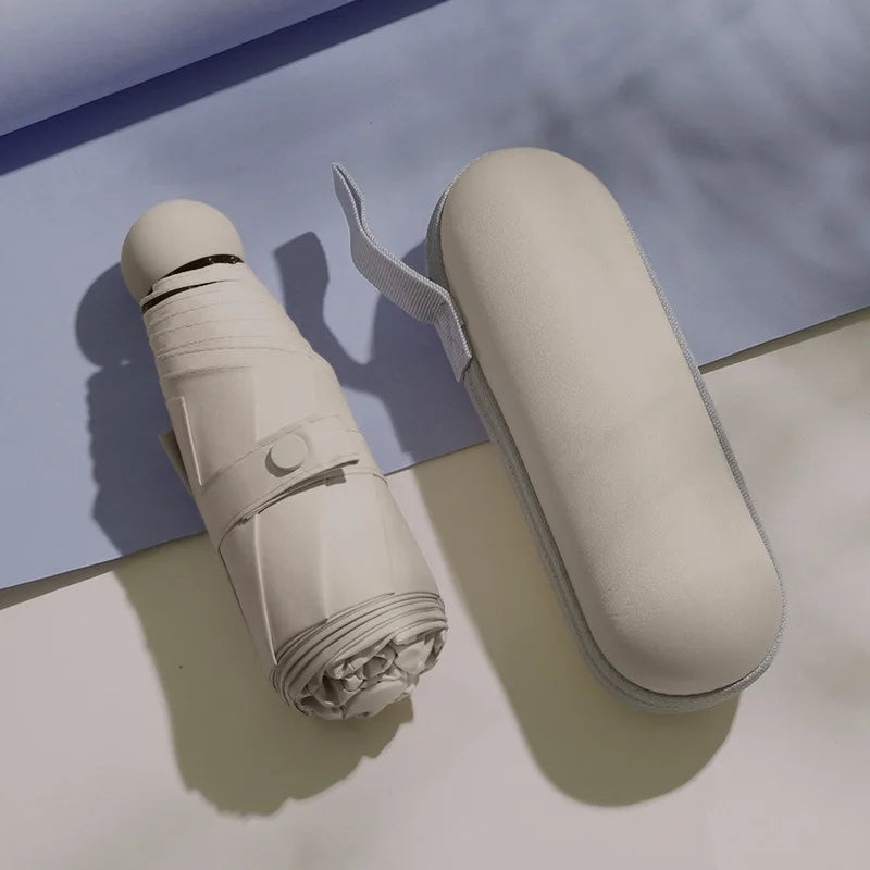 Beige mini capsule umbrella with compact carrying case