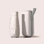 Beige mini pocket umbrella with protective capsule