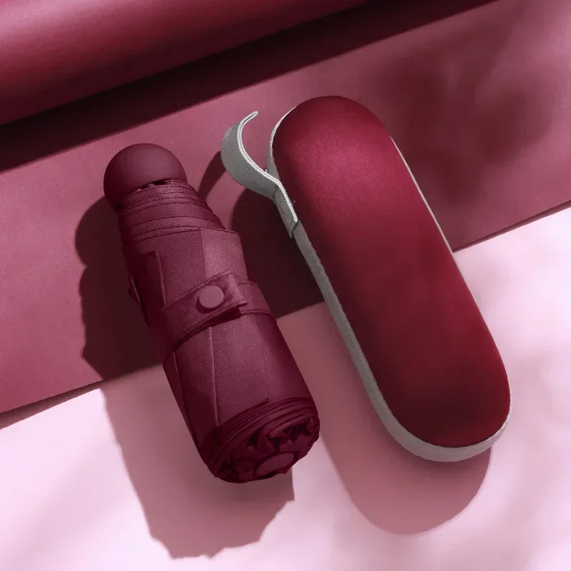 Burgundy mini capsule umbrella with compact carrying case