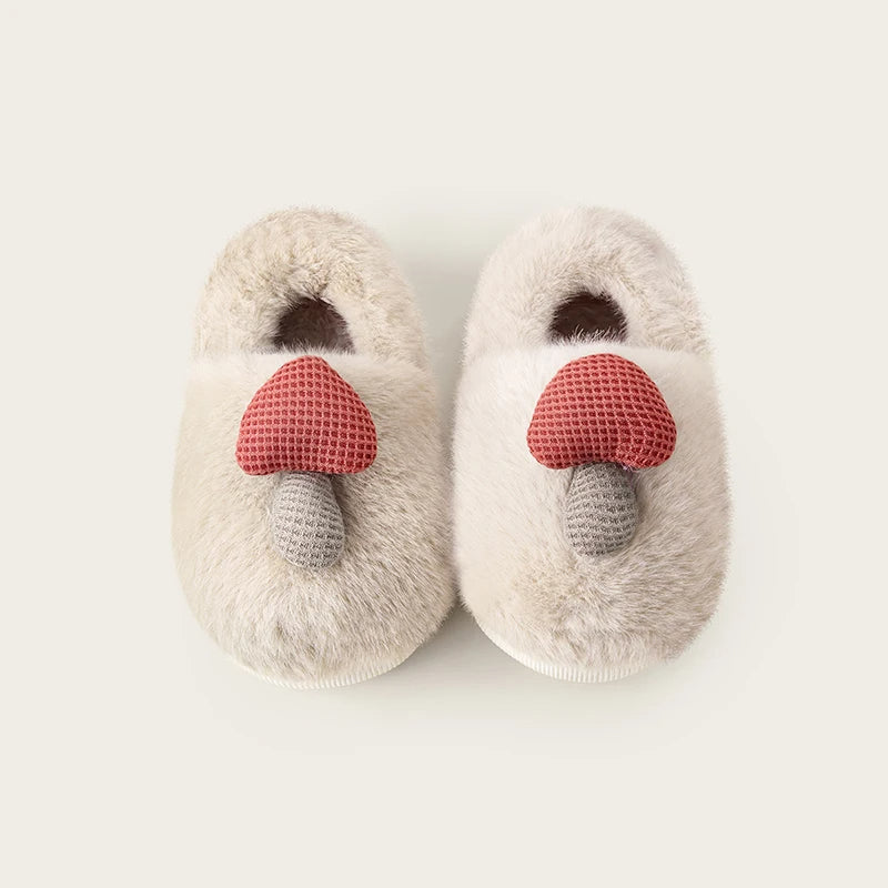 Cream mushroom bootie slippers for kids with pink mushroom detail