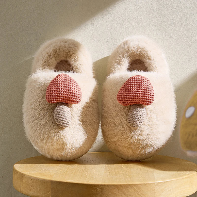 Cream mushroom bootie slippers for kids with pink detail – lifestyle view