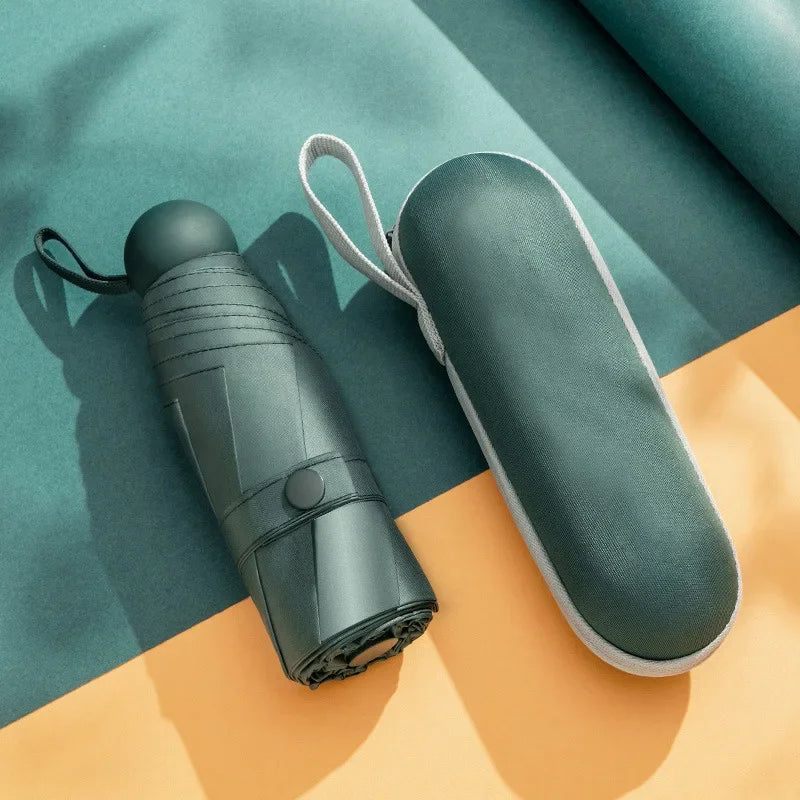 Green mini capsule umbrella with compact carrying case