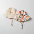 Kids reversible cotton bucket hat showing both wearable designs
