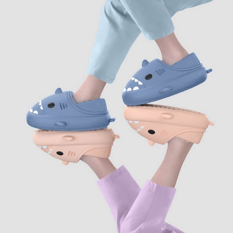 Kids wearing warm shark clogs with plush lining