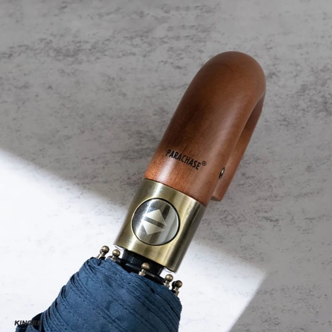 Parachase umbrella wooden handle and automatic button detail