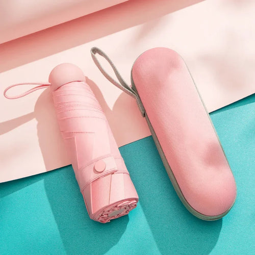 Pink mini capsule umbrella with compact carrying case