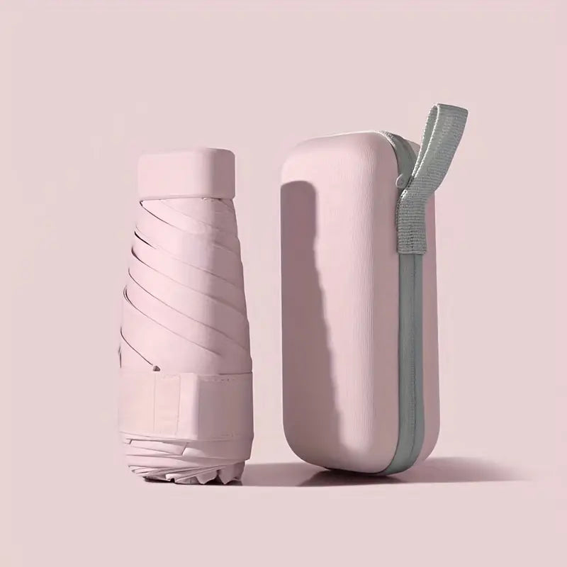 Powder pink mini pocket umbrella with protective capsule