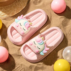 Pink and cream unicorn slippers for kids – lifestyle view
