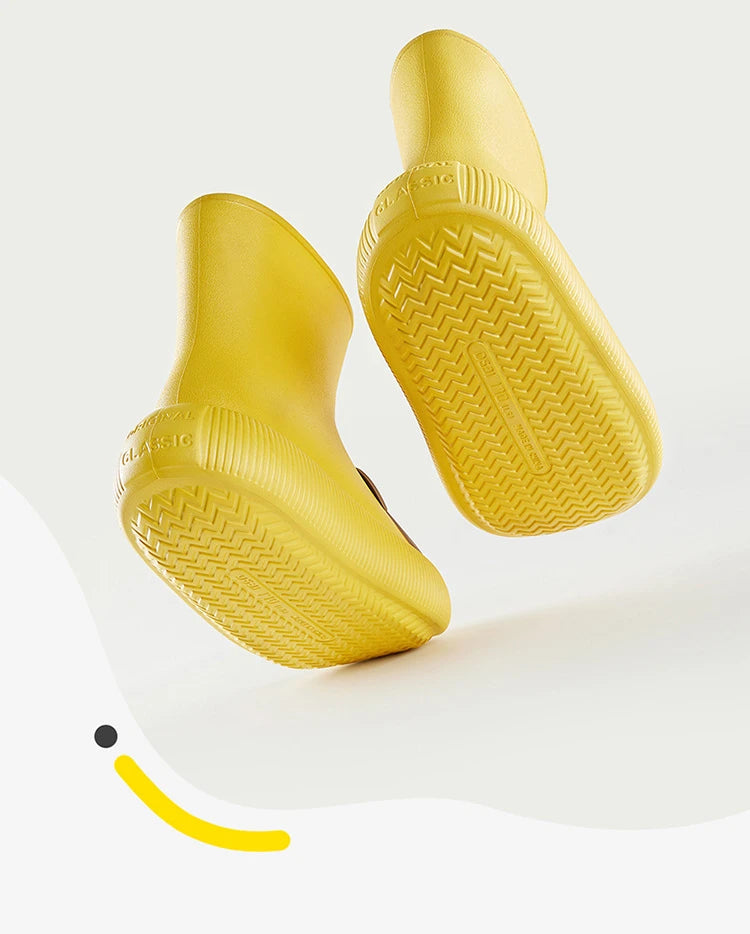 Yellow kids rain boots showing flexible sole design