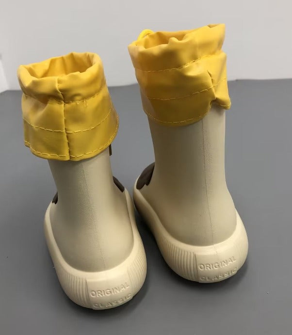 Yellow kids rain boots showing removable fleece bootie liner
