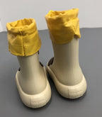 Yellow kids rain boots showing removable fleece bootie liner